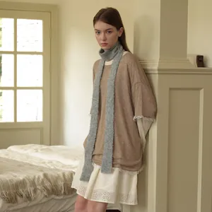 Slim wool blend scarf in light gray paired with a vintage lace dress and brown knit top