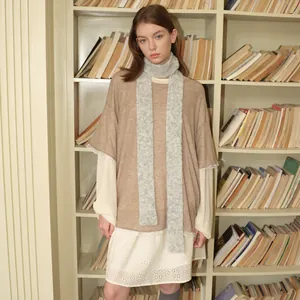 Slim wool blend knit scarf in light grey styled with a brown knit top and lace dress