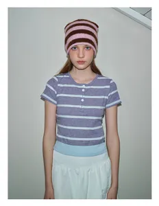 Detail of soft striped knit beanie paired with a purple and white striped henley shirt