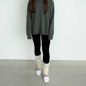 Chic beige wool blend ribbed leg warmers styled with white sneakers and cozy fall outfit