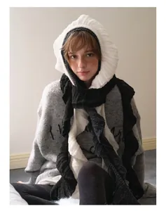 Close-up of Y2K ruffled hood scarf with wool blend knit texture and embroidery details