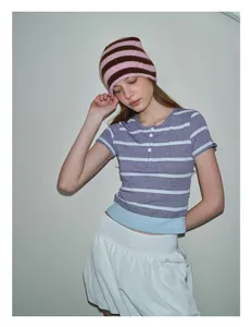 Detail of grey-purple striped knit hat with soft rolled edge and cute wool texture