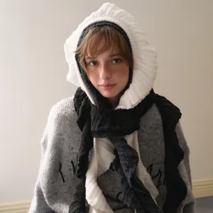 Y2K ruffles wool blend knitted balaclava scarf paired with a grey textured sweater