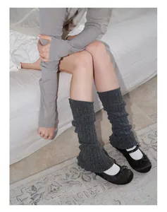 Close-up of grey wool-blend ribbed leg warmers in balletcore style for women