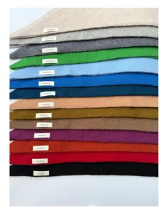 Close-up of 100% wool knit scarves in diverse colors showing soft twill texture