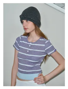 Detail of striped short sleeve Henley shirt with buttons and knitted beanie style