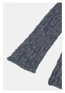 Detail shot of chunky dark grey cable knit wool blend scarf with soft fuzzy texture
