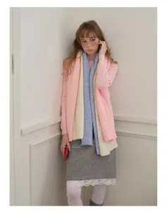 Detailed knit texture of pink, beige and blue patchwork wool scarf for women
