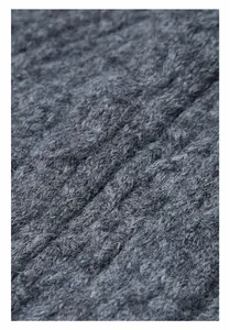 Detailed macro view of charcoal grey thick cable knit wool blend fabric texture