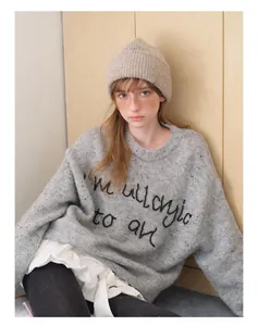 Detail of grey wool blend knit sweater featuring I'm allergic to all embroidery