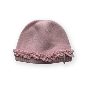 Pink wool blend knitted beanie with ruffled edges and bow detail for girls