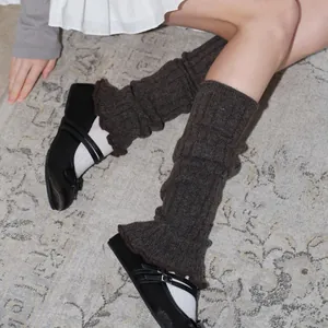 Brown wool blend cable knit leg warmers in balletcore style with wavy lace trim
