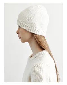 Detail shot of the white wool knit beanie ribbed texture and soft fabric finish