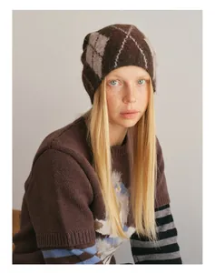 Close-up of wool blend argyle knit beanie and sweater with soft fuzzy texture