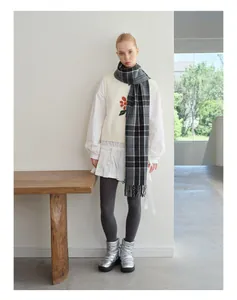 Classic grey plaid wool blend scarf with tassel ends styled with an autumn winter outfit