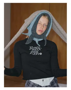 Detailed texture of multi-layered wool blend knit neck gaiter with rabbit ear hood