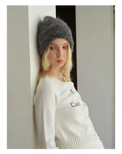 Close-up of the fuzzy alpaca blend knit beanie texture and warm wool fabric details