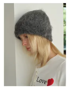 Close-up detail of soft grey alpaca wool knit beanie showing fluffy texture and warmth