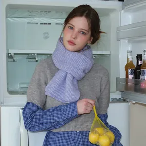 Lilac ribbed knit wool scarf for women with thick texture in lifestyle setting