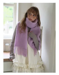 Detailed texture of lavender alpaca wool blend scarf with elegant long fringes