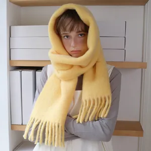 Soft bright yellow alpaca wool blend scarf with long tassels for winter warmth