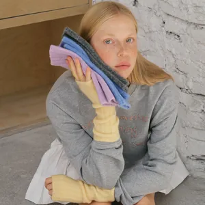 Women's 30% wool blend knitted fingerless gloves in pastel colors with rib texture