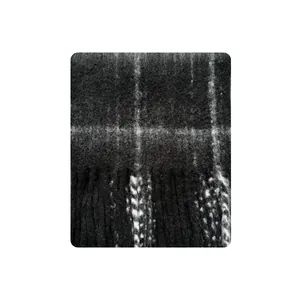 Classic black and white checkered wool blend scarf featuring soft tassels and fuzzy texture