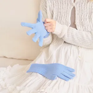 Women's 100% wool knit gloves in light blue with ribbed cuffs and touchscreen capability
