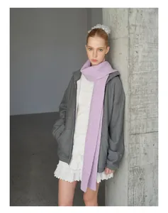 Close-up of soft purple wool blend scarf paired with a grey hoodie and lace dress