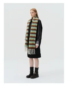Close-up of fluffy alpaca wool blend scarf featuring brown, teal, and beige stripes