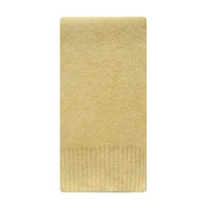Minimalist ginger yellow wool knit scarf with soft texture and ribbed hem on white background