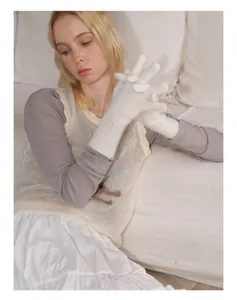 Detailed texture of white raccoon hair blend knit gloves with long ribbed cuffs