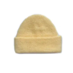 Thick light yellow wool blend knit beanie for women featuring a seamless double-layer design