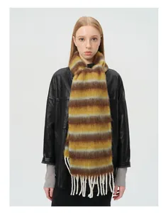 Detail of alpaca wool blend striped scarf with brown tones and long cream tassels