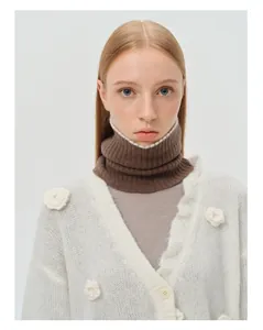 Detailed close-up of dark brown ribbed knit neck warmer with soft wool texture details