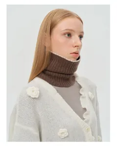 Close-up of brown ribbed knit wool neck warmer styled with a white floral cardigan