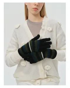 Detailed texture of colorful rainbow striped knit gloves with wool blend material