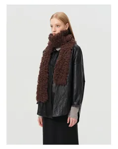 Detail of plush brown 100% wool scarf paired with a black leather jacket for winter