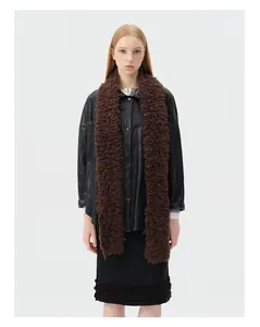 Detail of soft dark brown curly wool scarf paired with a black faux leather jacket