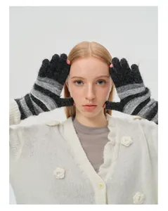 Close-up of rainbow striped knit wool gloves showing high-quality texture and stripe detail