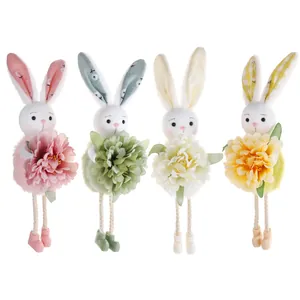 Set of four plush Easter bunny ornaments holding fabric flowers in spring colors