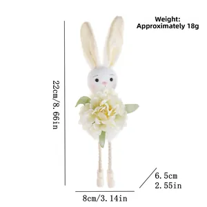 Detailed view of white plush Easter bunny ornament with floral accent and dimensions