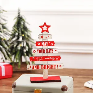 Wooden DIY Christmas tree tabletop ornament with red star and festive holiday greetings