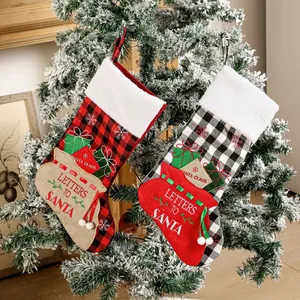 Set of two buffalo plaid Christmas stockings with plush fur trim and Santa embroidery