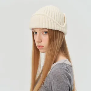 Cream knit wool blend aviator beanie for women with wide folded brim and ribbed texture