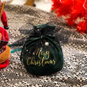 Dark green velvet Christmas gift bag with gold Merry Christmas print and lace bow