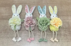 Set of four pastel plush bunnies with long rope legs and floral decorations for Easter