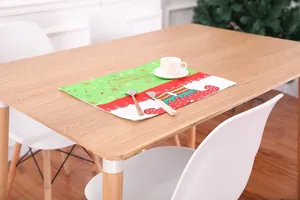 Close-up of Santa's little helper Christmas placemat with elf shoes and snowflake pattern