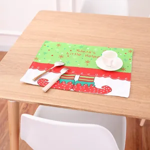 Christmas elf placemat featuring Santa's Little Helper design on a festive wooden table