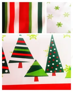 Detailed fabric pattern of Christmas apron with festive stripes, snowflakes and stylized trees